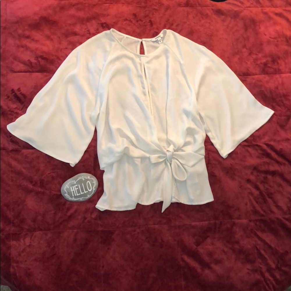 Elegant Express peephole/peplum blouse in EUC